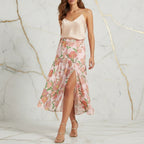Woman in floral pink skirt with left slit and satin top, stylish apparel at Ivorynn