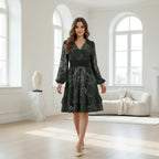 Woman in elegant black patterned dress walking in bright luxury apartment with modern furniture