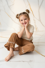 Girl Sitting Playful Pose
