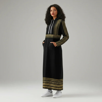 Woman in a black and gold embroidered hoodie dress, white sneakers, studio backdrop, Ivorynn fashion