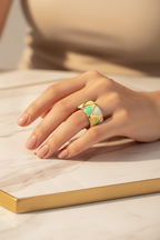 Green Ring Hand on Marble