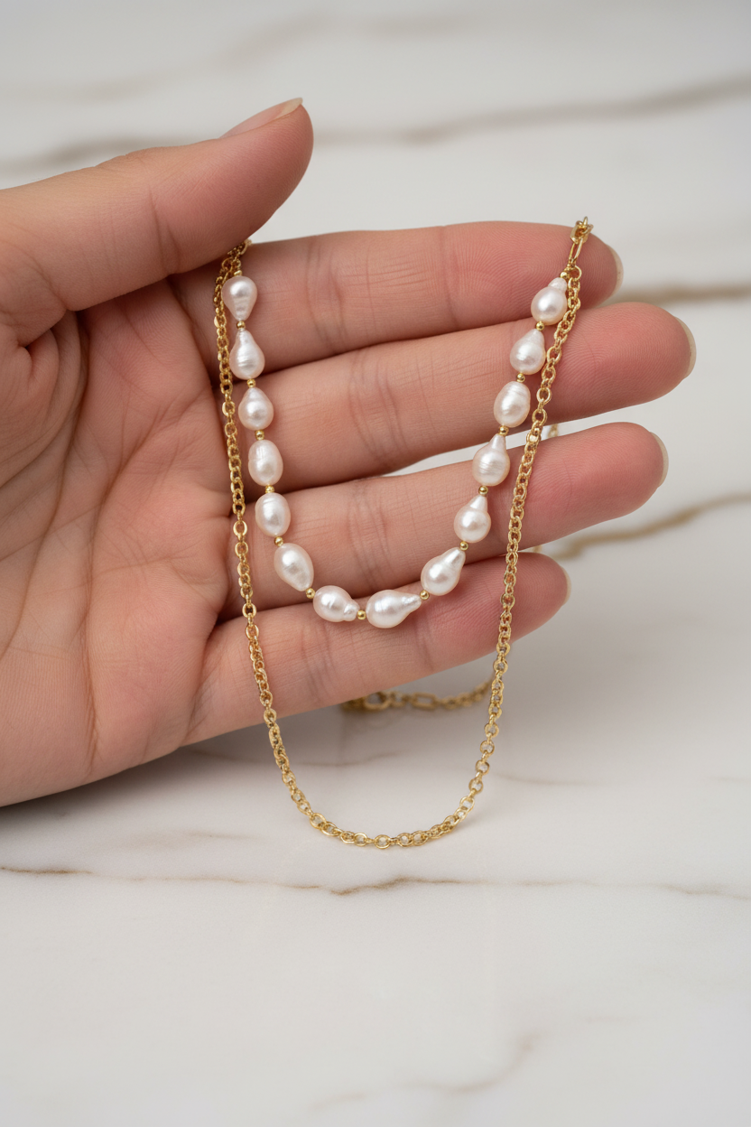 Hand holding necklace detail