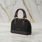 IVORYNN bag on gold marble - angled view