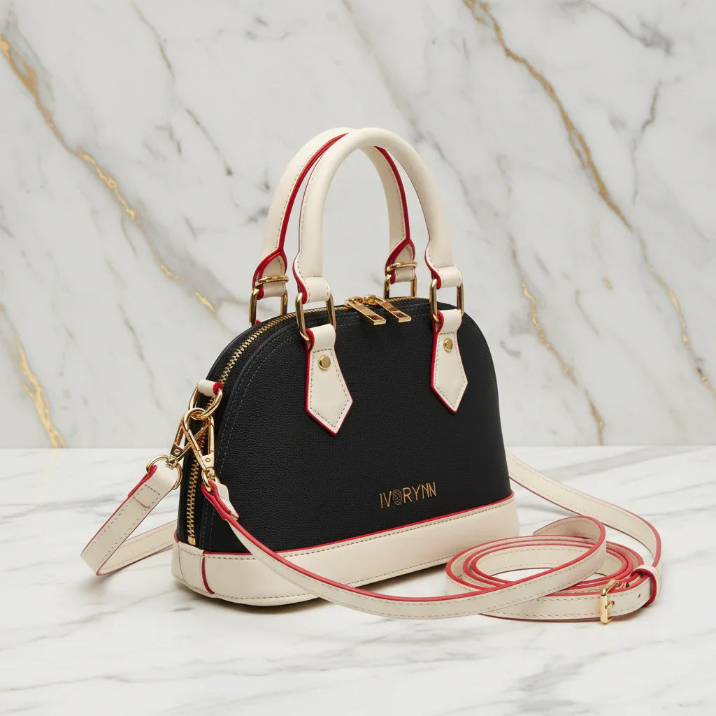 IVORYNN bag - side angle view on gold marble