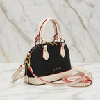 IVORYNN bag - side angle view on gold marble