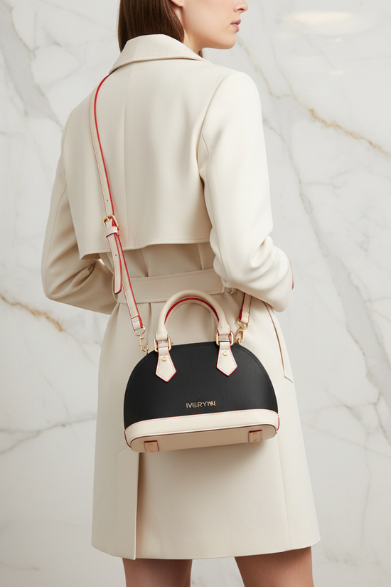 IVORYNN bag worn crossbody - back angle on gold marble