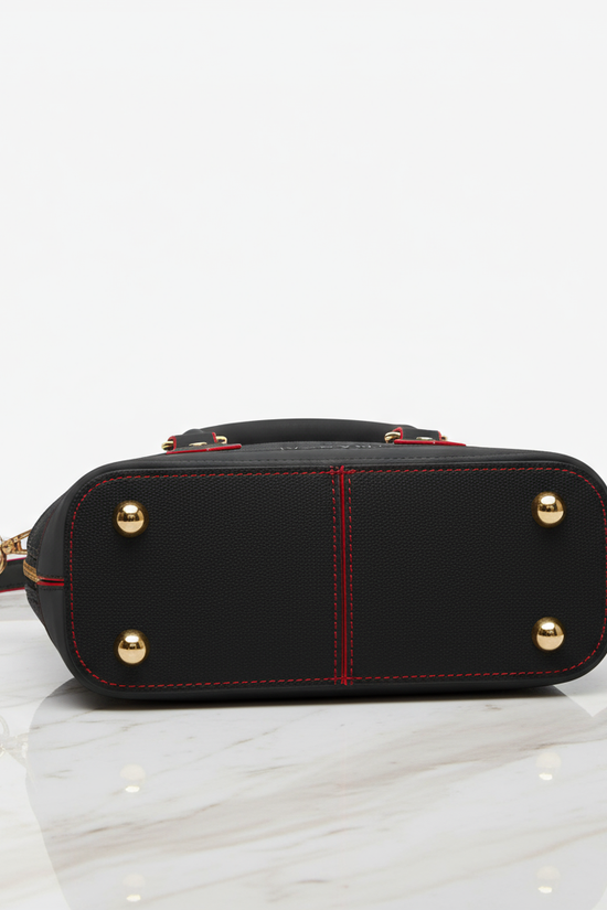 IVORYNN black bag - bottom view on gold marble