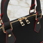 IVORYNN black bag - close-up hardware details on gold marble