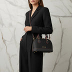 IVORYNN black bag on arm - three-quarter view on gold marble