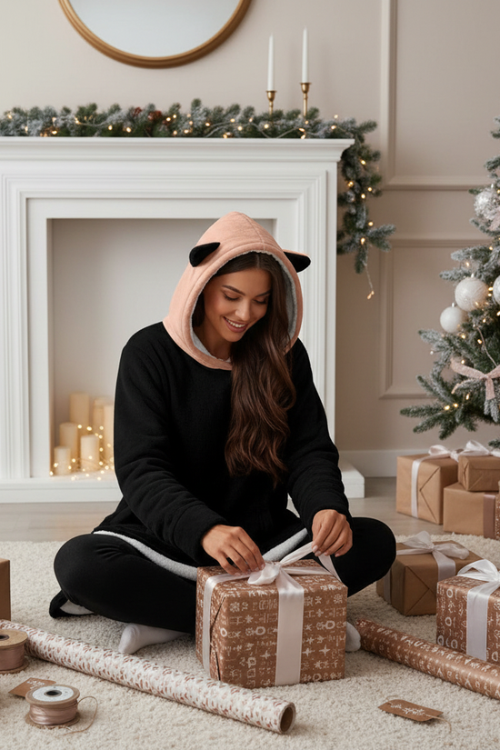 Joyful gift wrapping scene on floor