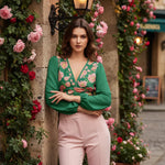 Leaning against flower-covered wall