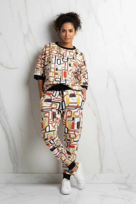 Leaning against wall, hands in pockets