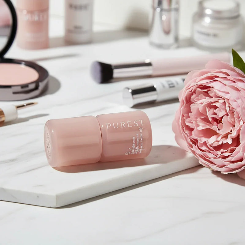 Lipstick with peony on marble