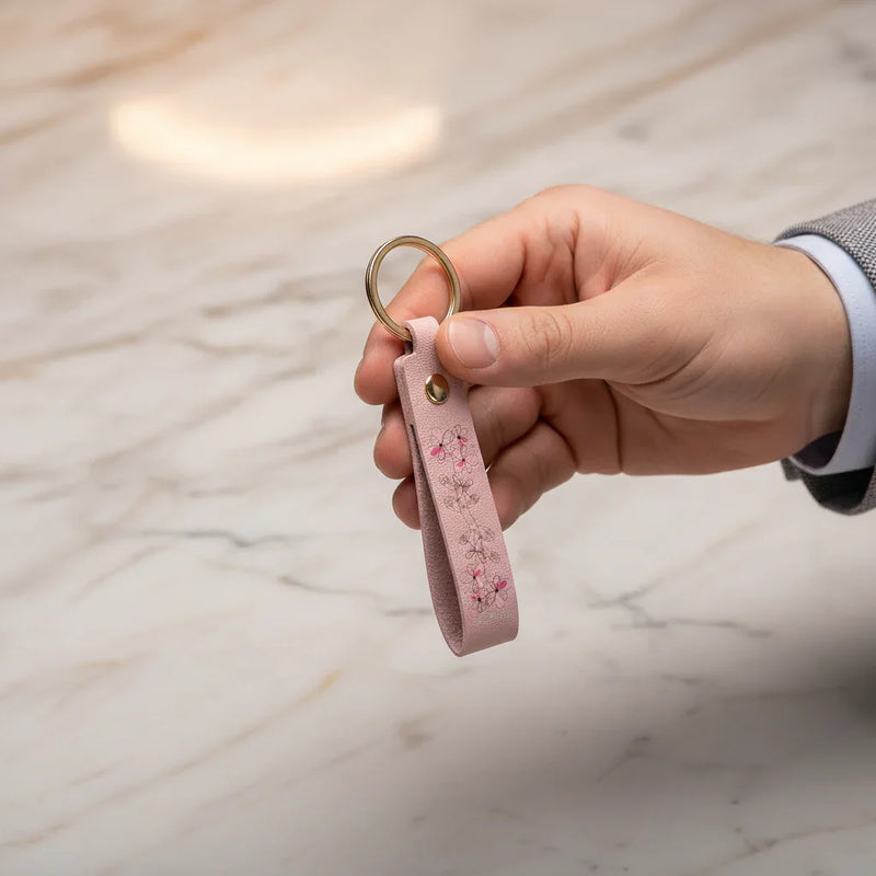 Man holding keychain - three-quarter view