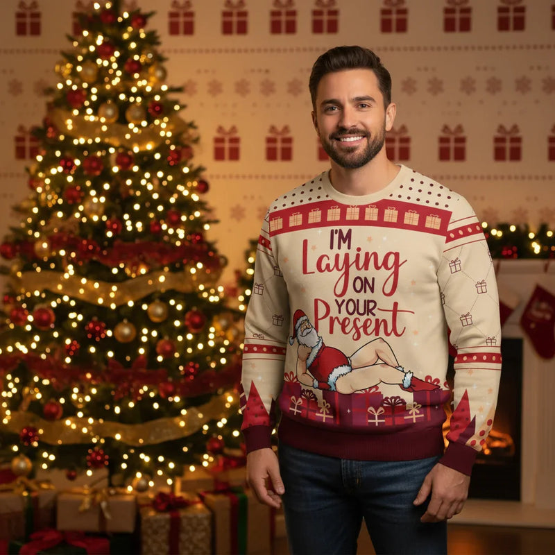 Man in Christmas sweater - By Christmas tree