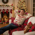 Man in Christmas sweater - Relaxing on sofa
