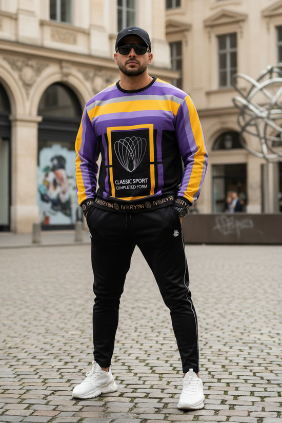 Man in luxury sweatshirt on European cobblestone street