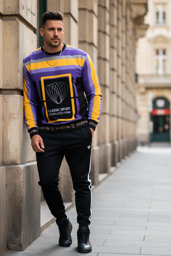 Man in sweatshirt against European building