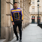 Man in sweatshirt against European building