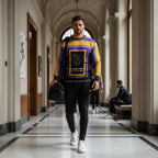 Man in sweatshirt walking through sports club hallway