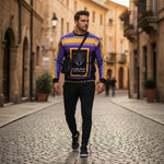 Man wearing sweatshirt walking through European street