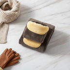 Neatly folded with scarf and gloves