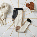 Neatly folded with scarf and gloves