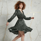 Woman modeling stylish black floral dress in motion, Ivorynn luxury apparel, marble backdrop
