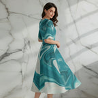 Woman in teal marble print midi dress posing, stylish apparel by Ivorynn
