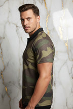Man in camo print polo shirt posing against marble background for Ivorynn men's fashion