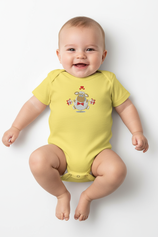 Overhead view of baby in yellow onesie