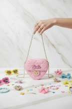 Pink bag - hand holding chain with kids accessories