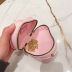 Pink bag - opened by hand marble background