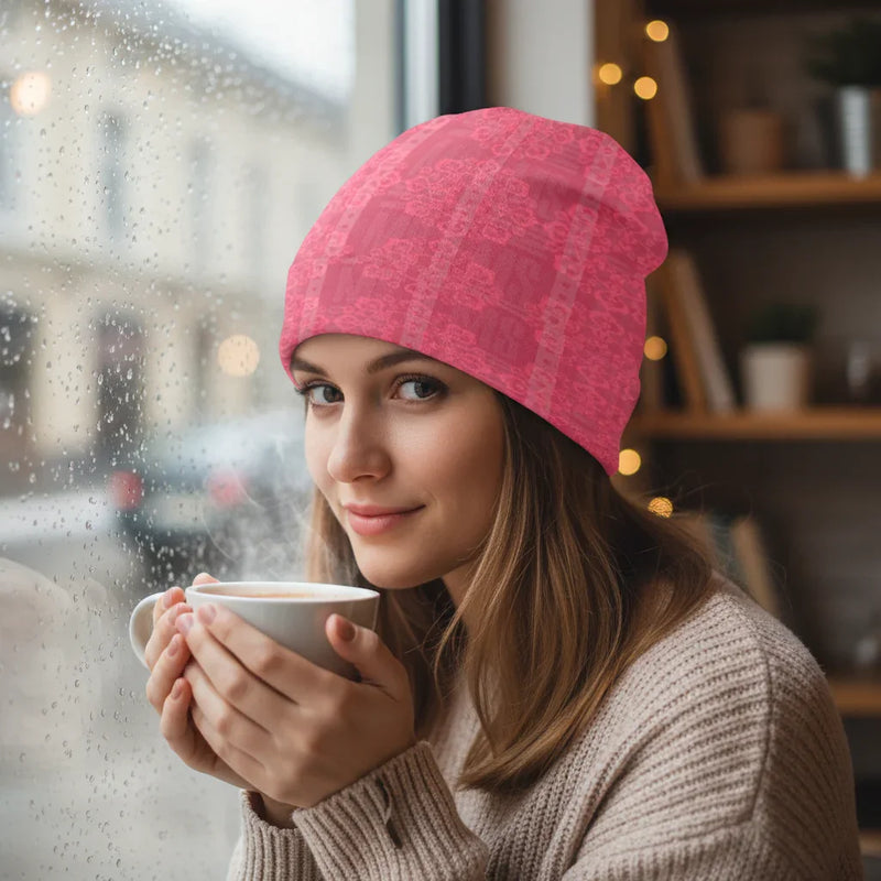 Woman wearing pink floral knitted hat sipping coffee indoors by window, Ivorynn fashion