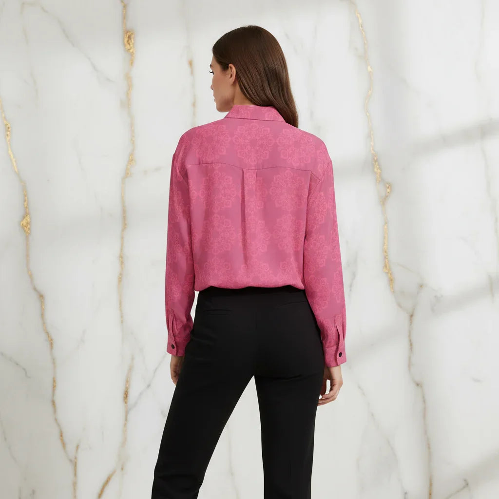 Woman wearing a pink floral shirt and black pants, back view, fashion apparel at Ivorynn