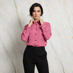 Woman wearing pink floral shirt with collar and black pants, Ivorynn fashion apparel