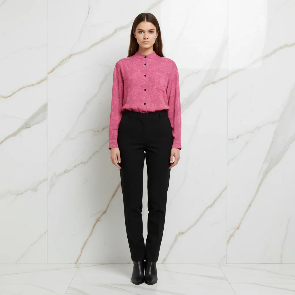 Woman in pink floral shirt and black pants, front view, stylish fashion at Ivorynn