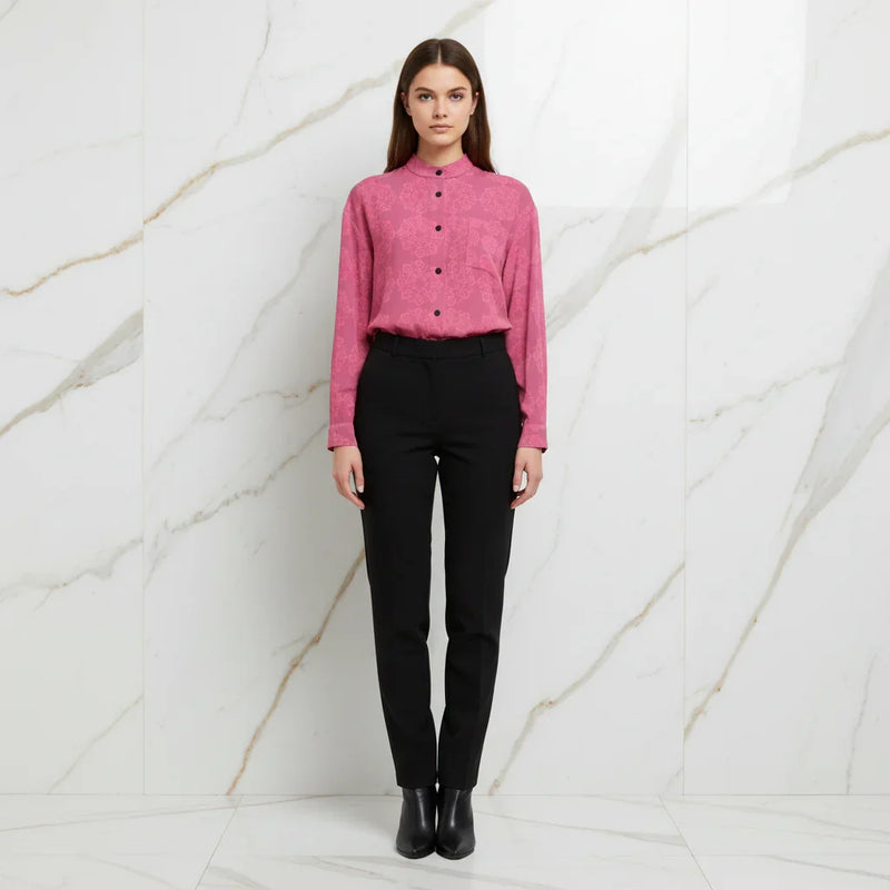 Woman in pink floral shirt and black pants, front view, stylish fashion at Ivorynn