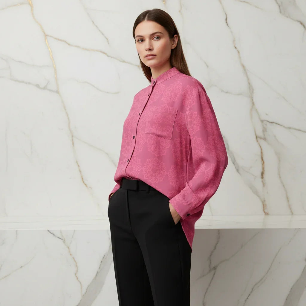 Woman wearing a pink floral shirt and black pants, stylish apparel Ivorynn fashion