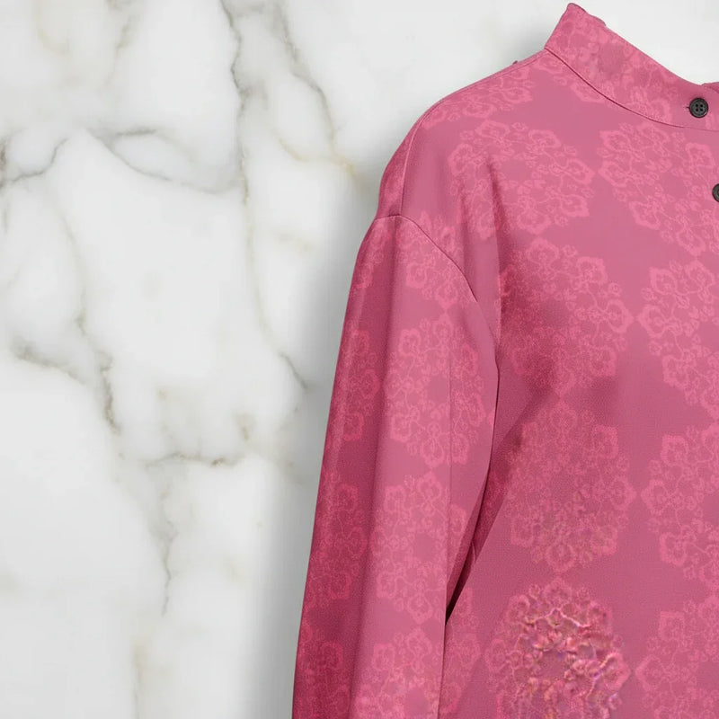 Pink floral patterned shirt shoulder detail against a marble background, Ivorynn fashion
