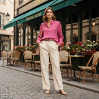Woman in pink floral shirt and beige trousers, street style fashion, Ivorynn apparel