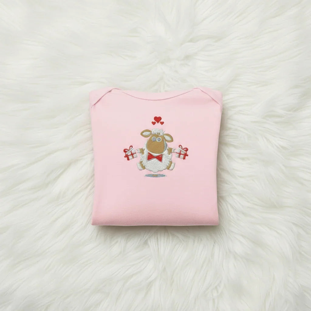 Pink onesie folded neatly showing design
