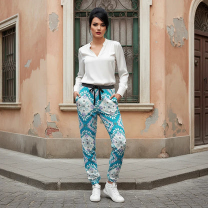 Stylish woman in white blouse and blue patterned pants on Italian street corner, Ivorynn fashion