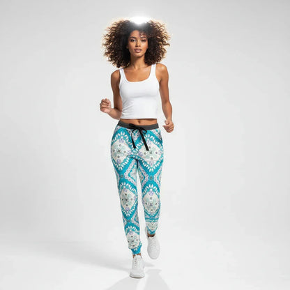 Woman modeling stylish blue patterned joggers and white tank top in studio, Ivorynn fashion