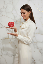 Red bag - holding on palm cream dress