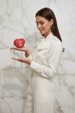 Red bag - holding on palm cream dress