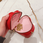 Red bag - opened by hand square