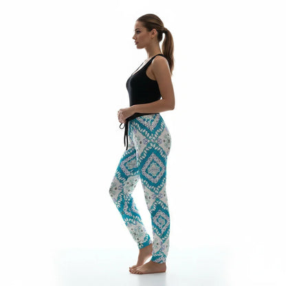 Woman in blue patterned jogger pants and black tank top, side profile, Ivorynn fashion apparel
