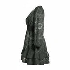 Black long sleeve mini dress with abstract white pattern, ruffled hem, at Ivorynn