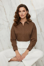 Seated pose with crossed legs on marble background